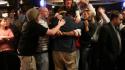 Friends Embrace the Champion