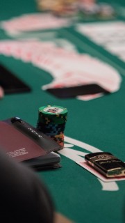 Does a straight beat trips in poker